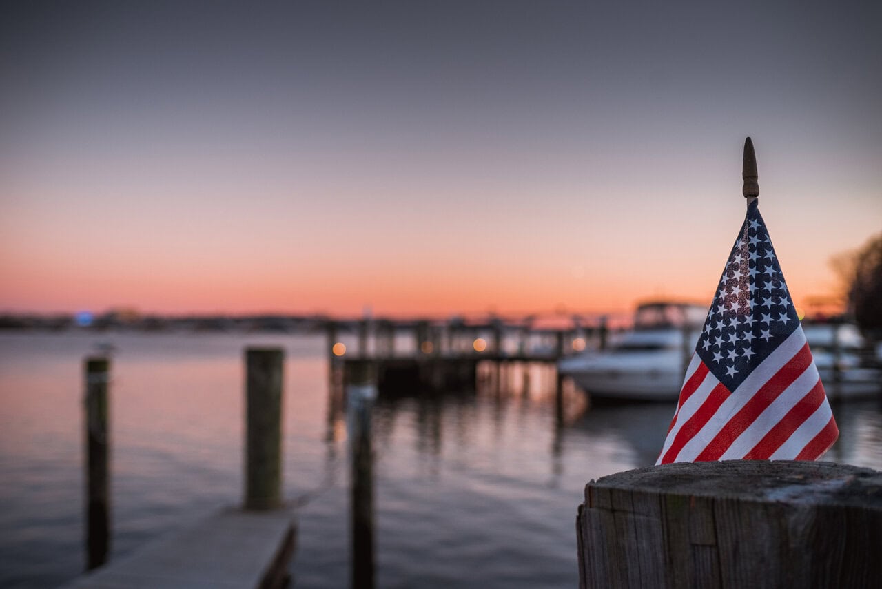 Veterans Resource Library hero image: An American Flag Sunset